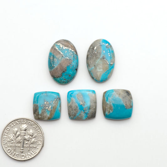 Nacozari turquoise cabochons are striking gemstones known for their vibrant blue to greenish-blue colors and pyrite, these stones are prized in jewelry making.