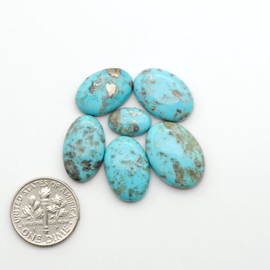 Nacozari turquoise cabochons are striking gemstones known for their vibrant blue to greenish-blue colors and pyrite, these stones are prized in jewelry making.