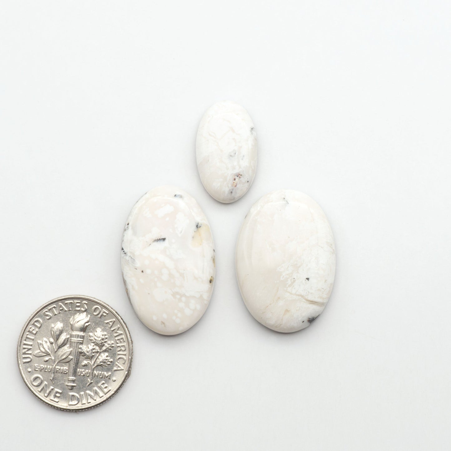 Natural White Buffalo Stone Cabochons are semi-precious gemstones cut into shapes ideal for jewelry-making, making them an excellent choice for artisans.