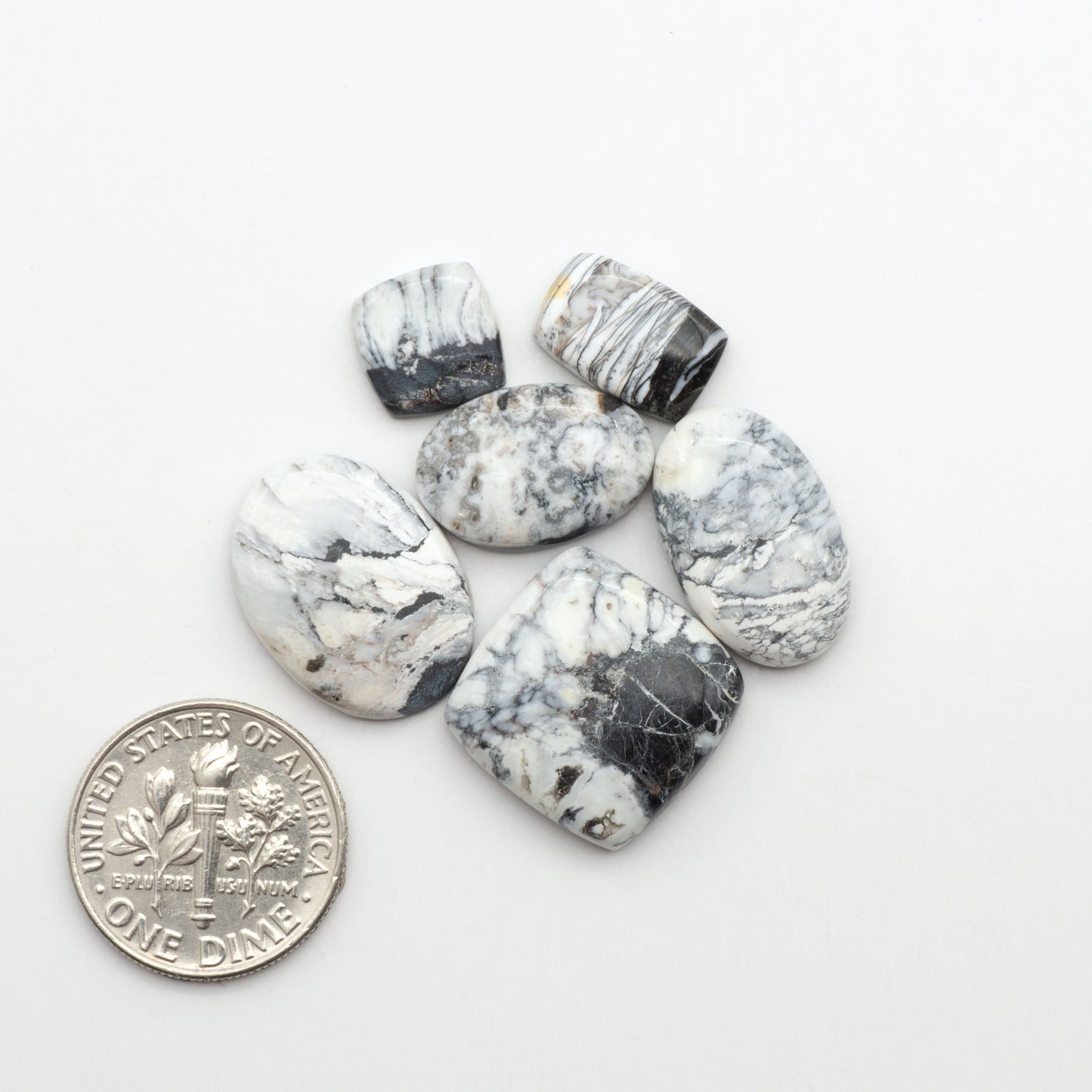 Natural White Buffalo Stone Cabochons are semi-precious gemstones cut into shapes ideal for jewelry-making, making them an excellent choice for artisans.