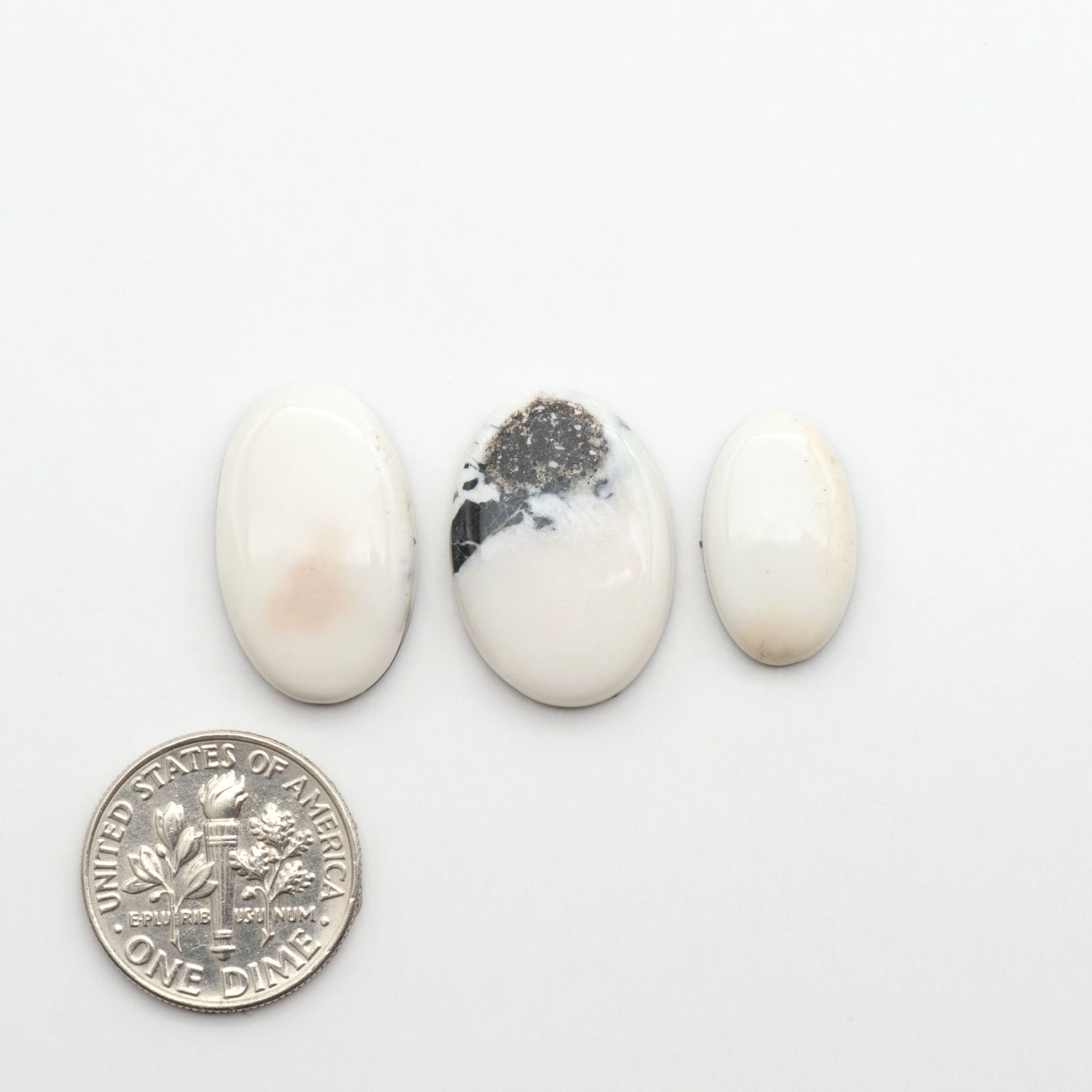 Natural White Buffalo Stone Cabochons are semi-precious gemstones cut into shapes ideal for jewelry-making, making them an excellent choice for artisans.