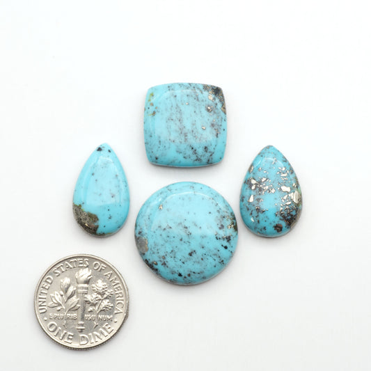 Nacozari turquoise cabochons are striking gemstones known for their vibrant blue to greenish-blue colors and pyrite, these stones are prized in jewelry making.