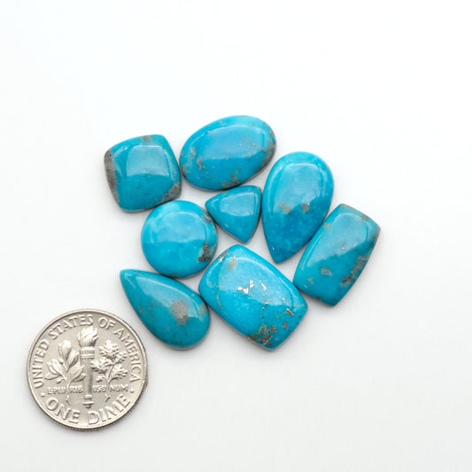Nacozari turquoise cabochons are striking gemstones known for their vibrant blue to greenish-blue colors and pyrite, these stones are prized in jewelry making.