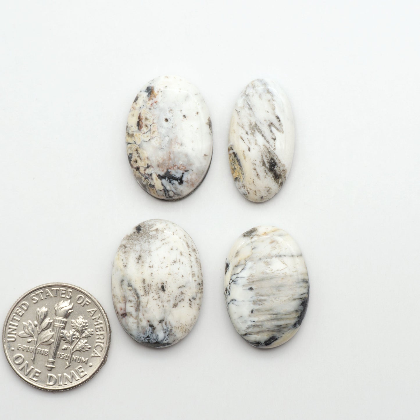 Natural White Buffalo Stone Cabochons are semi-precious gemstones cut into shapes ideal for jewelry-making, making them an excellent choice for artisans.