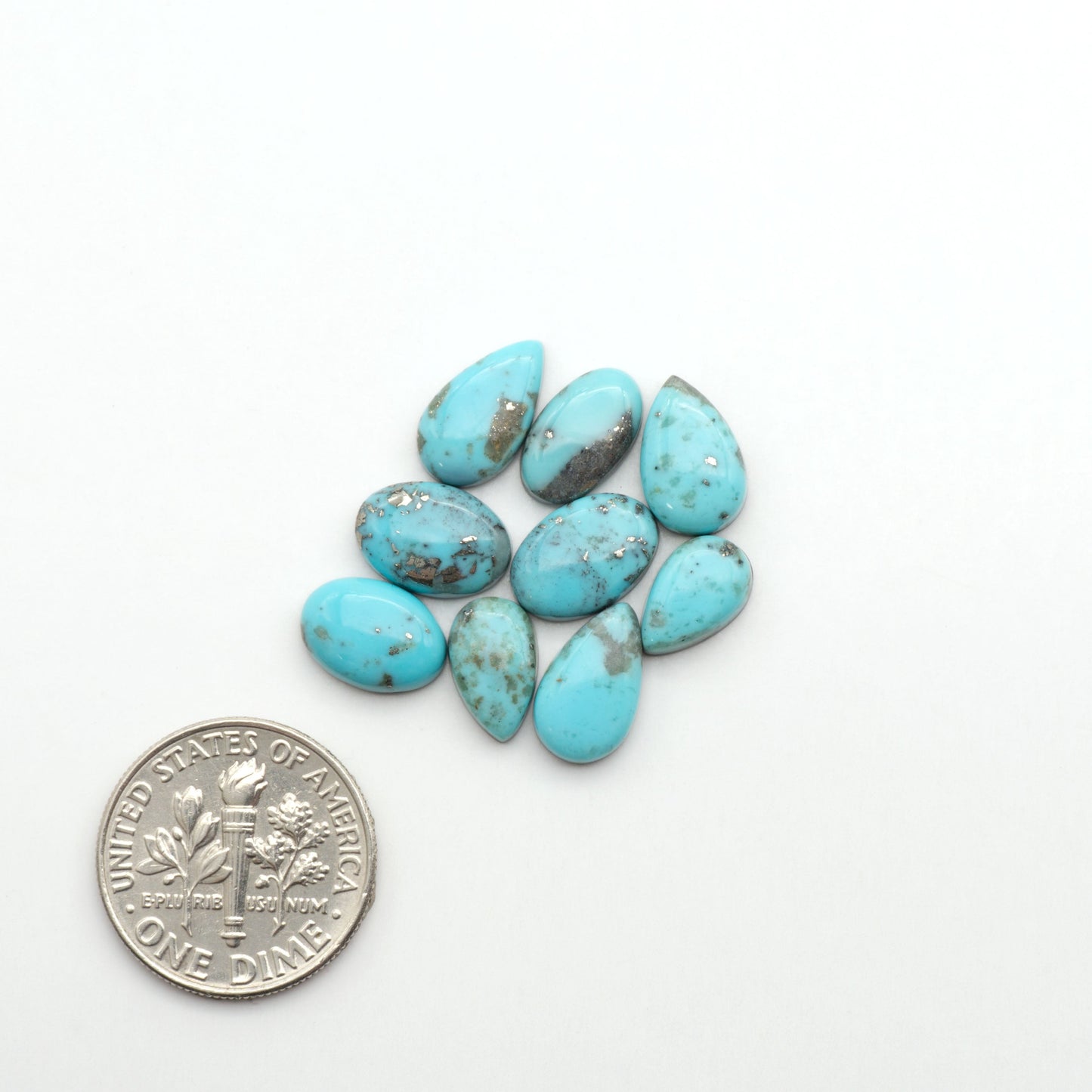 Nacozari turquoise cabochons are striking gemstones known for their vibrant blue to greenish-blue colors and pyrite, these stones are prized in jewelry making.