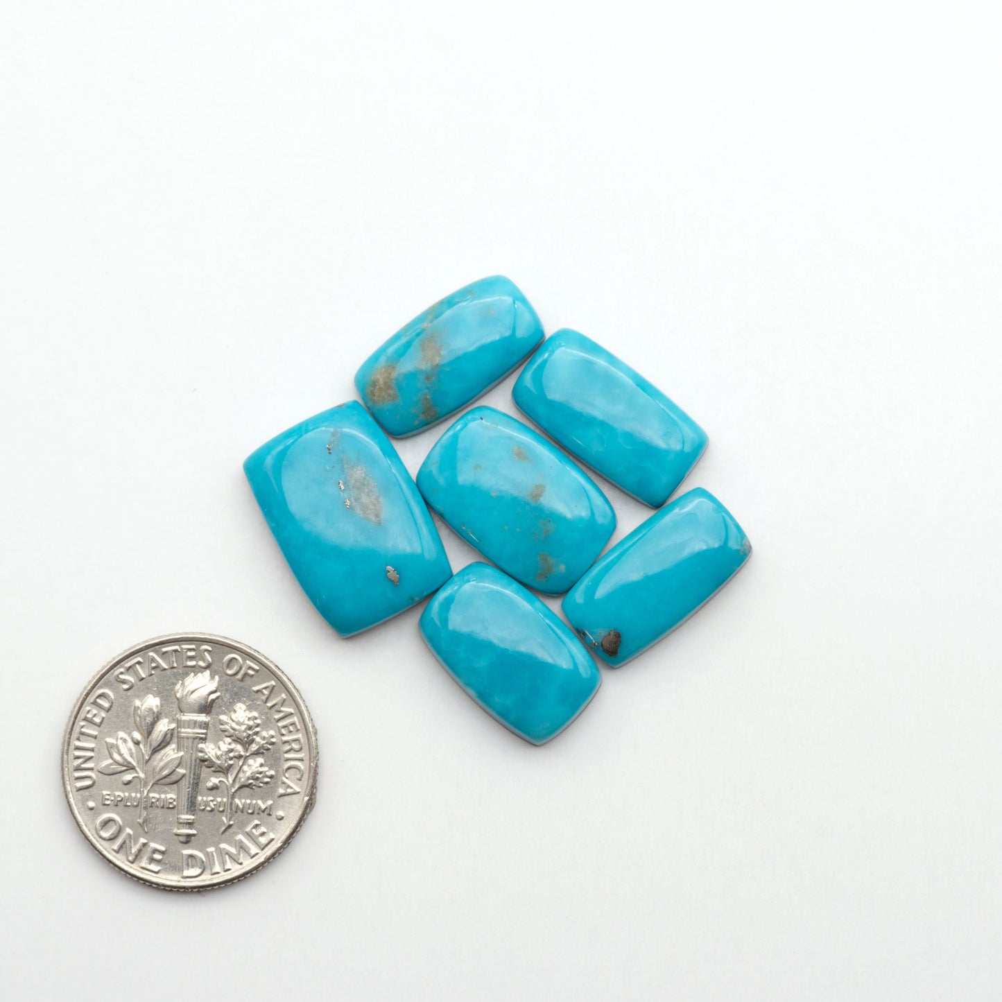 Nacozari turquoise cabochons are striking gemstones known for their vibrant blue to greenish-blue colors and pyrite, these stones are prized in jewelry making.