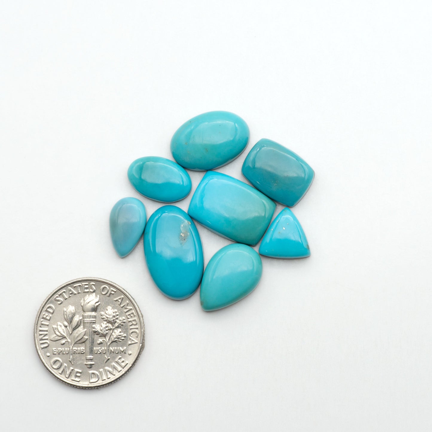 Nacozari turquoise cabochons are striking gemstones known for their vibrant blue to greenish-blue colors and pyrite, these stones are prized in jewelry making.