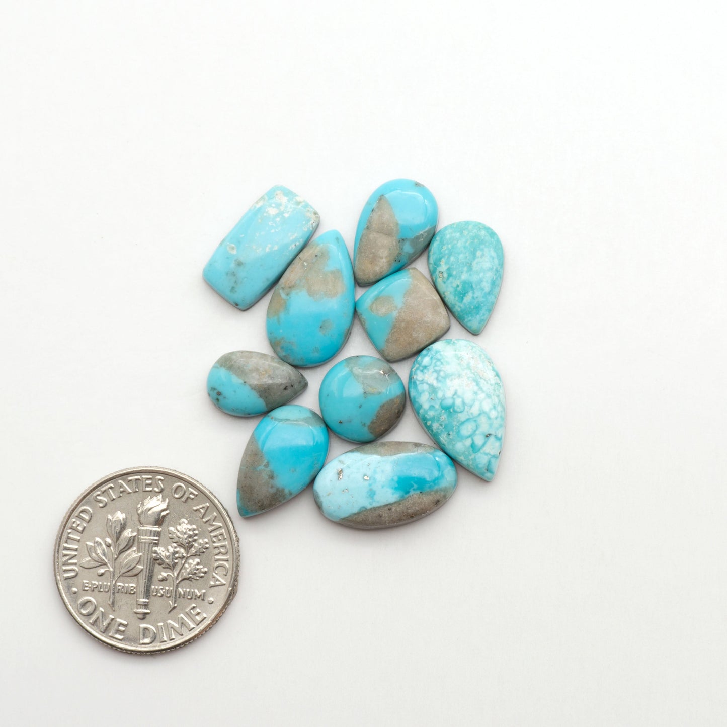 Nacozari turquoise cabochons are striking gemstones known for their vibrant blue to greenish-blue colors and pyrite, these stones are prized in jewelry making.