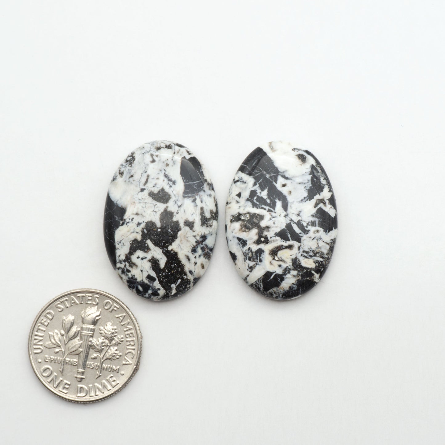 Natural White Buffalo Stone Cabochons are semi-precious gemstones cut into shapes ideal for jewelry-making, making them an excellent choice for artisans.