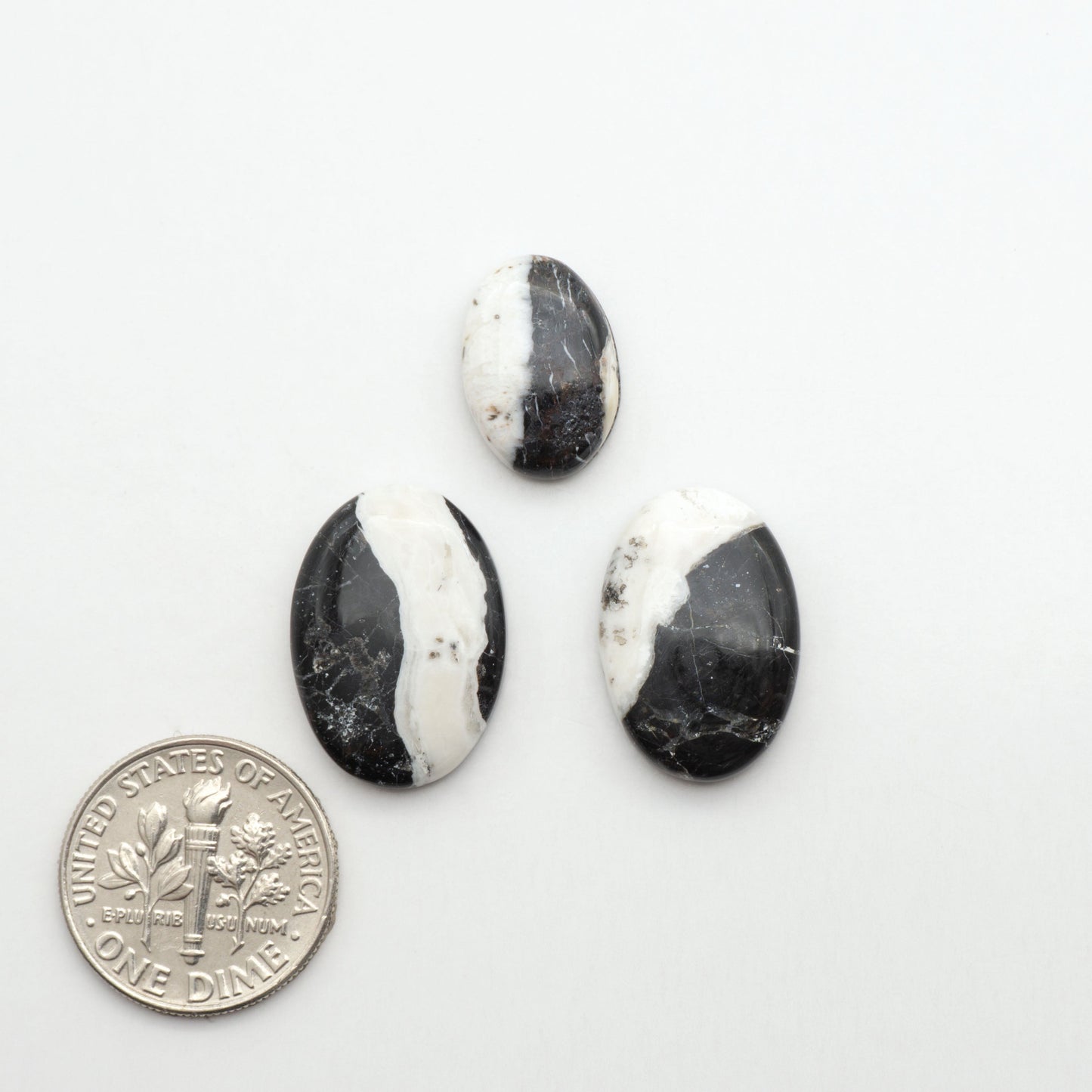 Natural White Buffalo Stone Cabochons are semi-precious gemstones cut into shapes ideal for jewelry-making, making them an excellent choice for artisans.