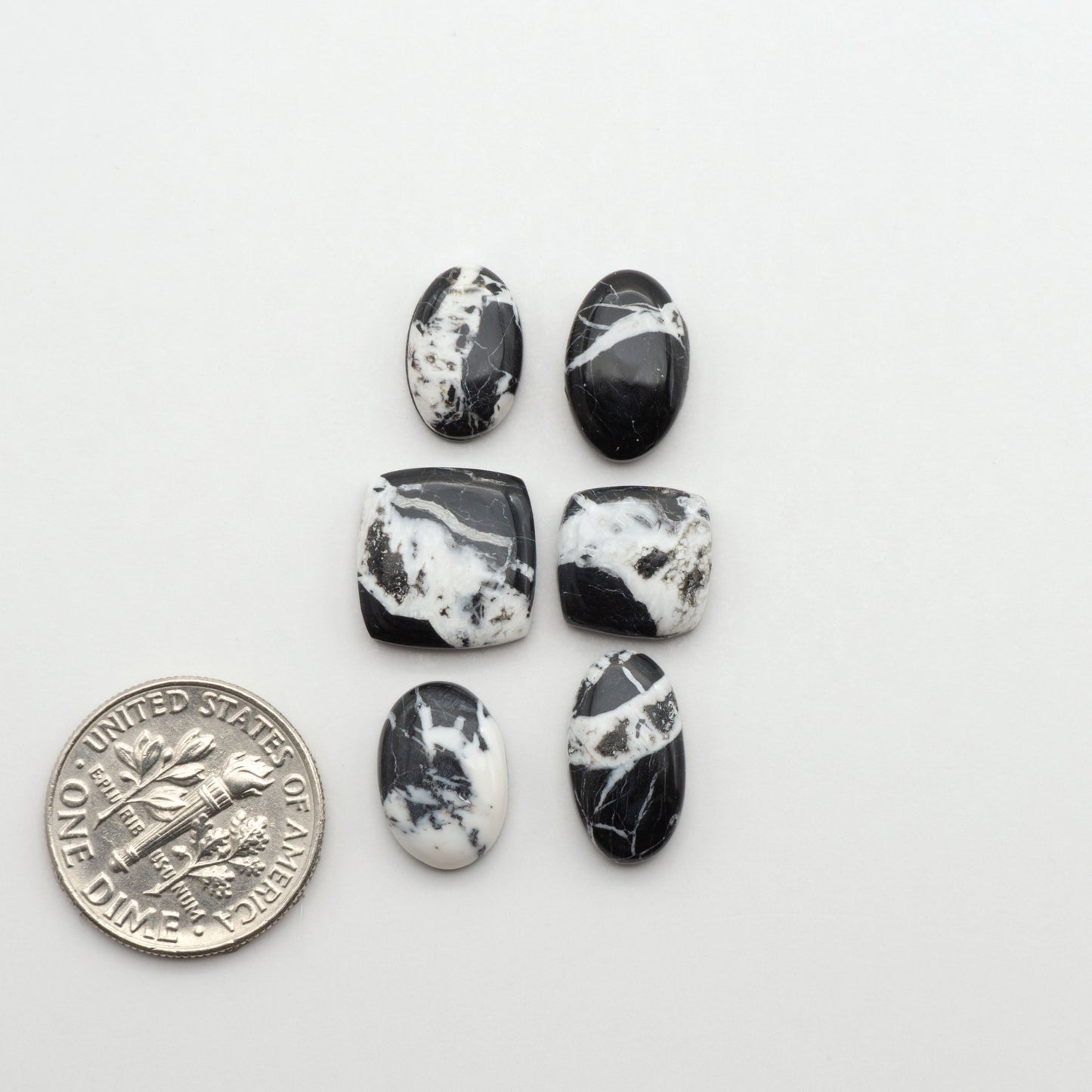 Natural White Buffalo Stone Cabochons are semi-precious gemstones cut into shapes ideal for jewelry-making, making them an excellent choice for artisans.