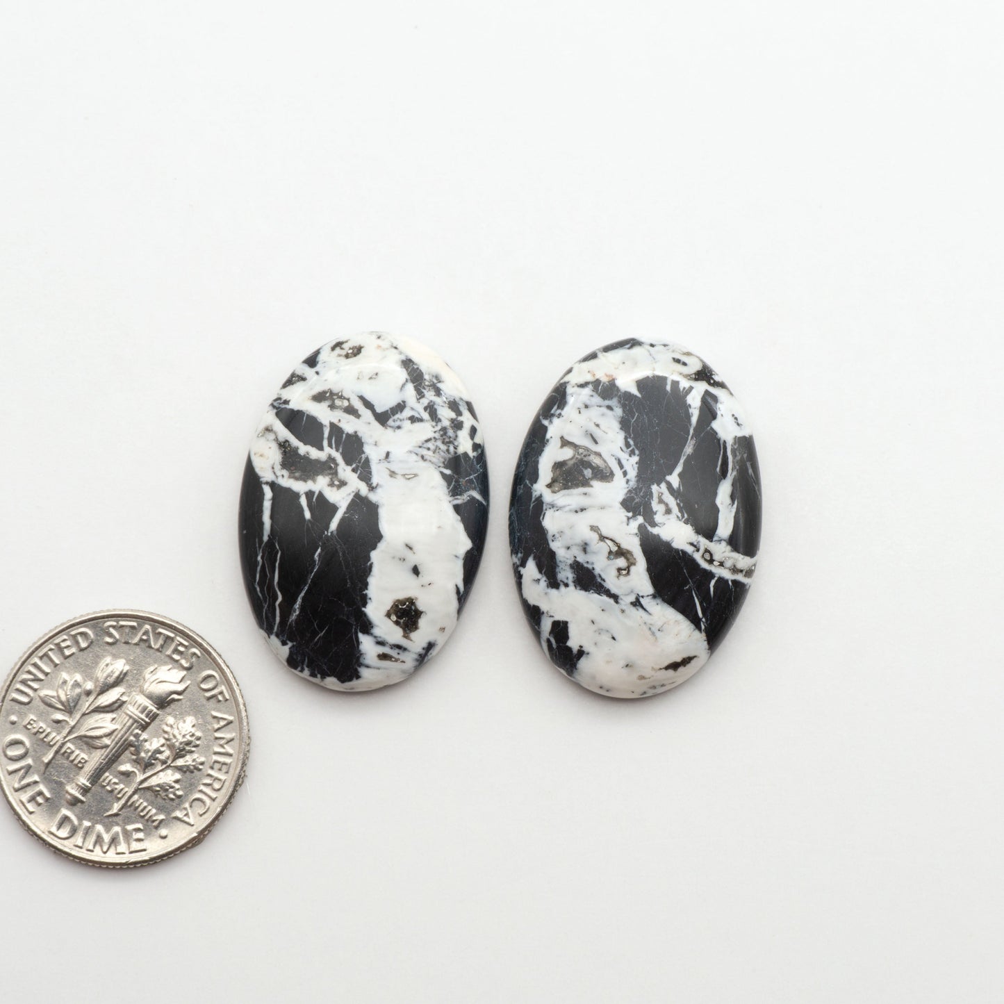Natural White Buffalo Stone Cabochons are semi-precious gemstones cut into shapes ideal for jewelry-making, making them an excellent choice for artisans.