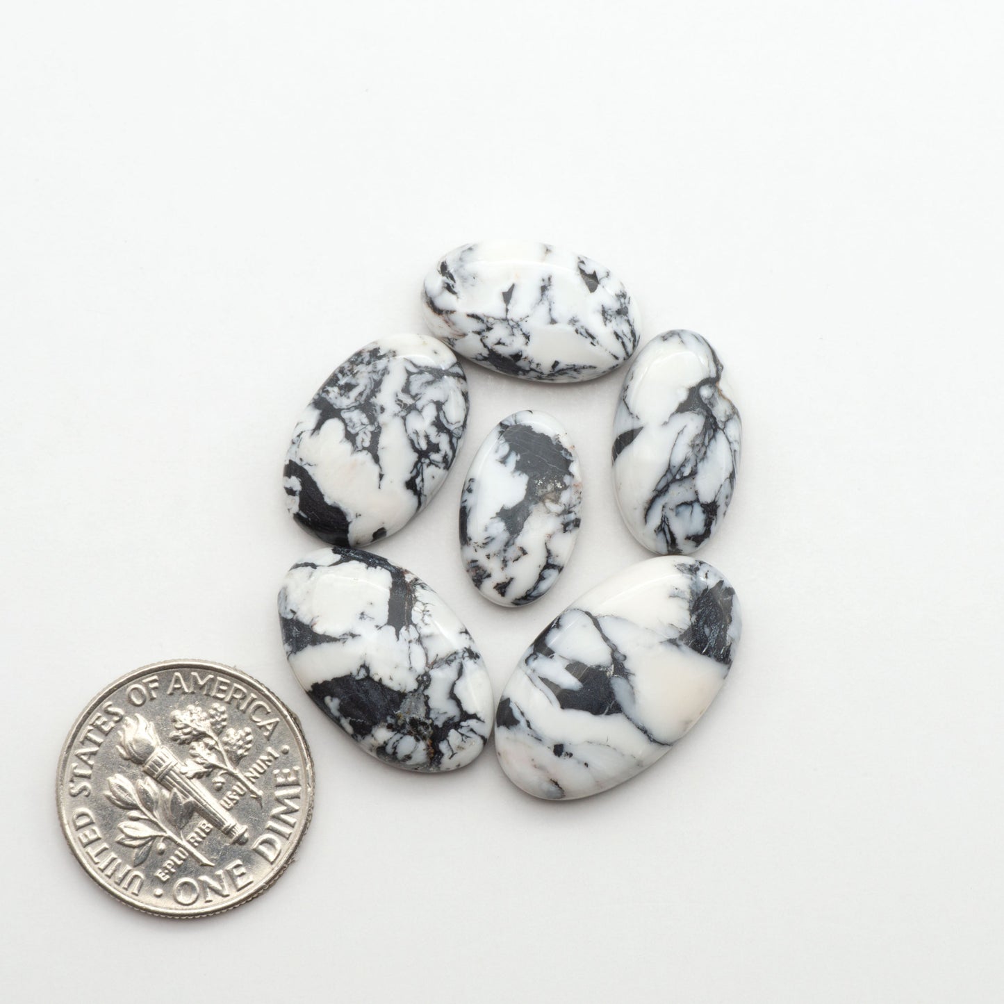 Natural White Buffalo Stone Cabochons are semi-precious gemstones cut into shapes ideal for jewelry-making, making them an excellent choice for artisans.