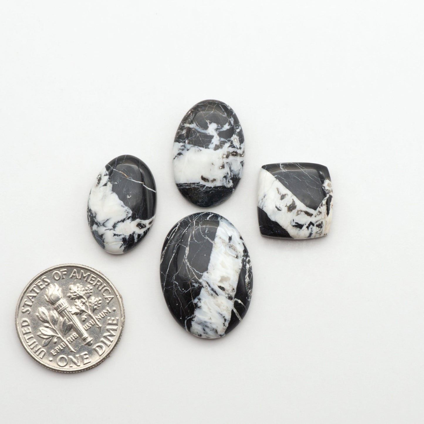 Natural White Buffalo Stone Cabochons are semi-precious gemstones cut into shapes ideal for jewelry-making, making them an excellent choice for artisans.