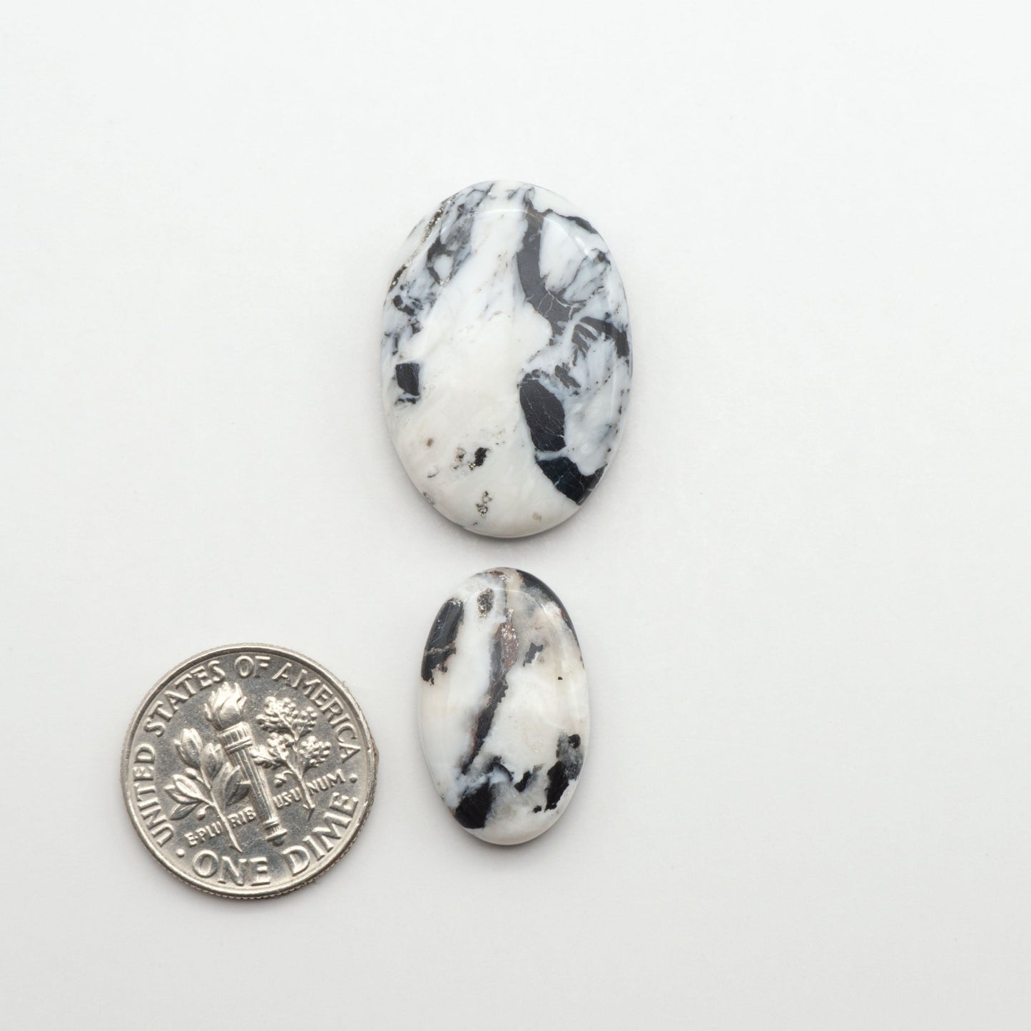 Natural White Buffalo Stone Cabochons are semi-precious gemstones cut into shapes ideal for jewelry-making, making them an excellent choice for artisans.