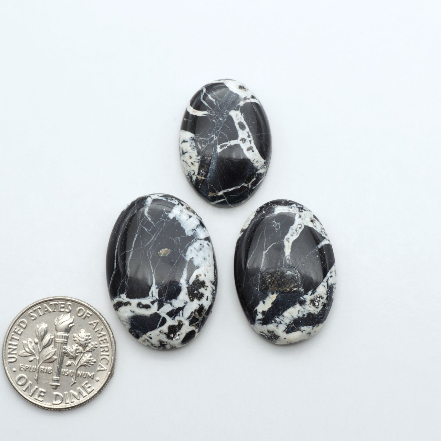 Natural White Buffalo Stone Cabochons are semi-precious gemstones cut into shapes ideal for jewelry-making, making them an excellent choice for artisans.