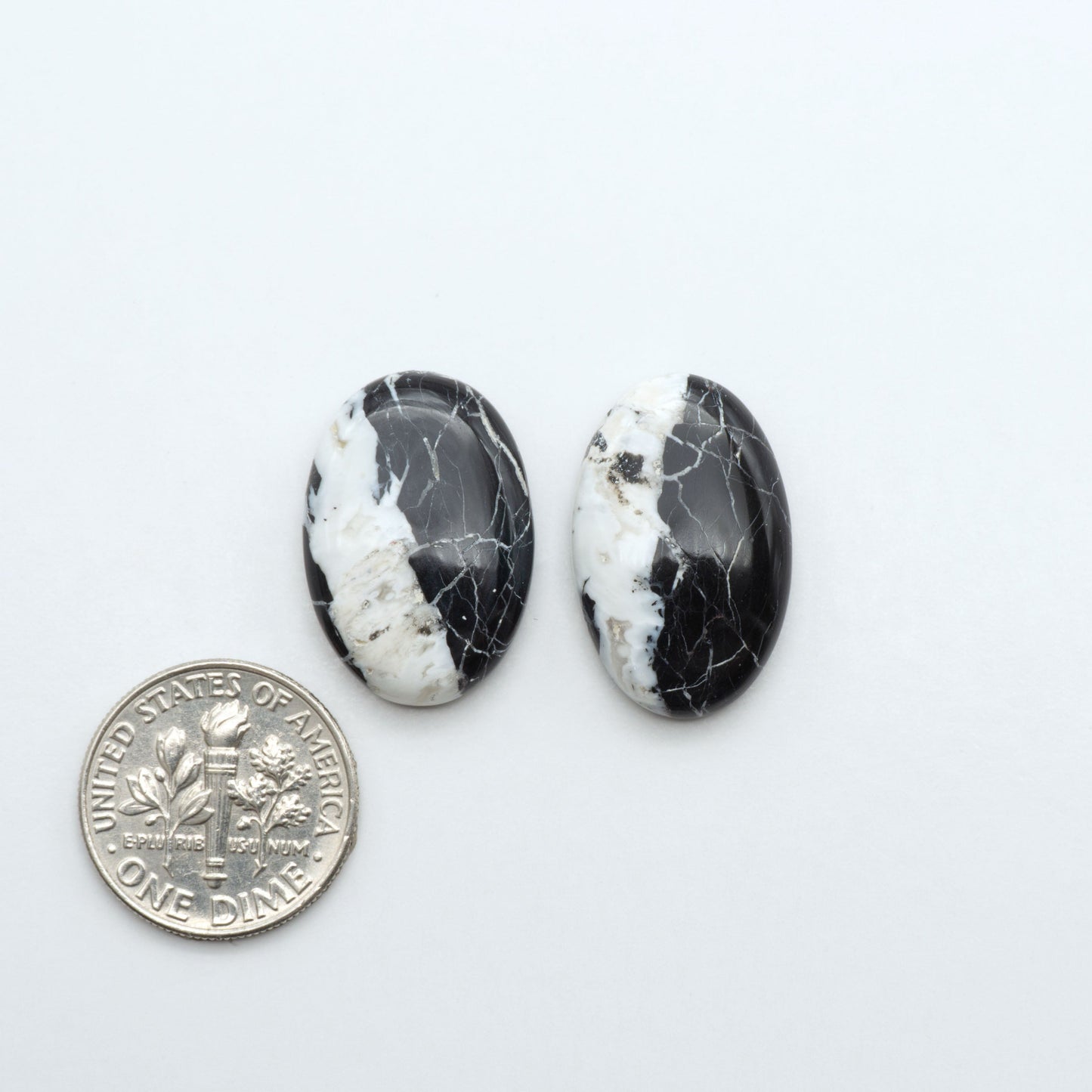 Natural White Buffalo Stone Cabochons are semi-precious gemstones cut into shapes ideal for jewelry-making, making them an excellent choice for artisans.