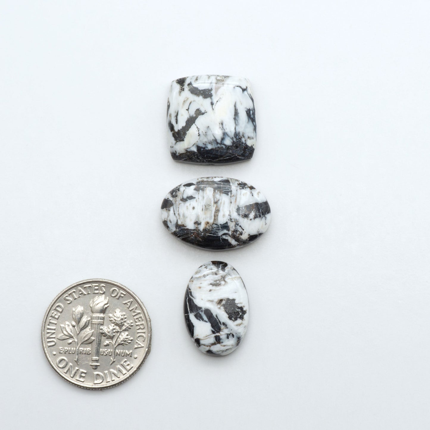 Natural White Buffalo Stone Cabochons are semi-precious gemstones cut into shapes ideal for jewelry-making, making them an excellent choice for artisans.