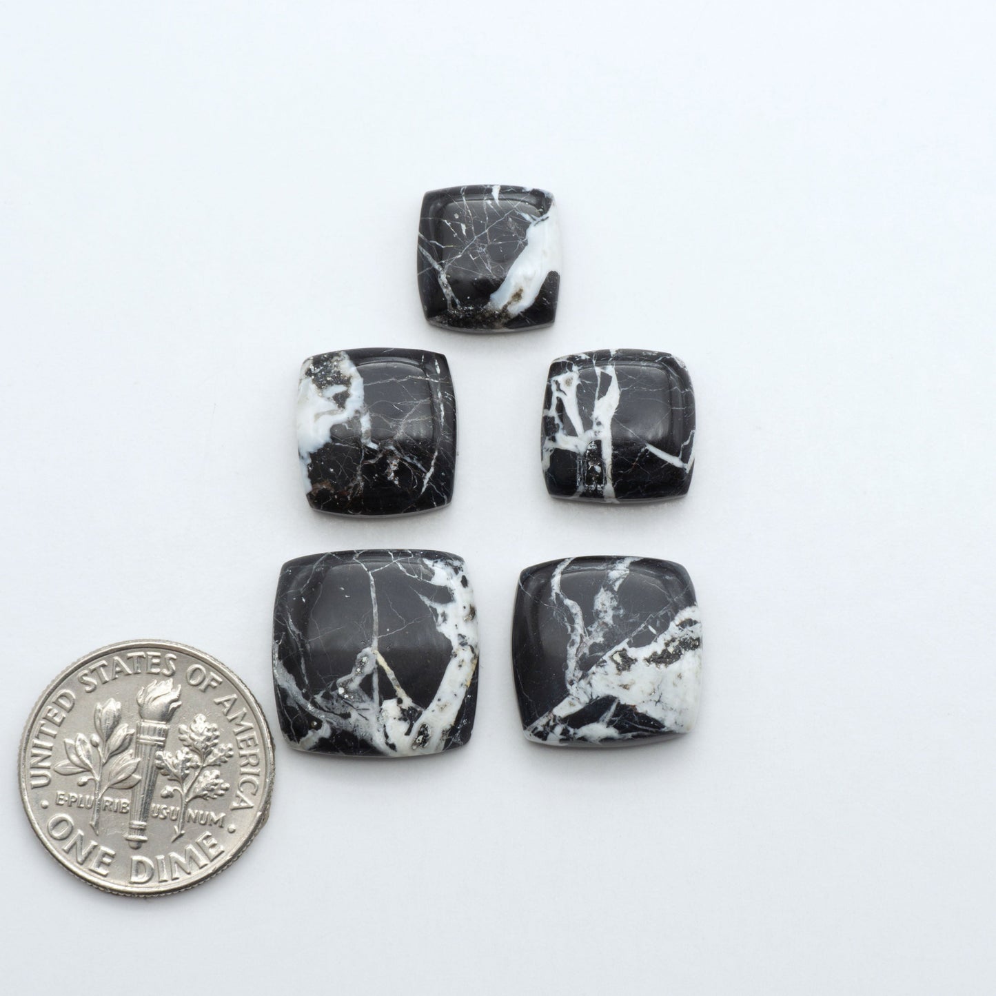Natural White Buffalo Stone Cabochons are semi-precious gemstones cut into shapes ideal for jewelry-making, making them an excellent choice for artisans.