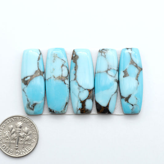 Enhance your jewelry designs with Pressed Turquoise Nugget Cabochons. Crafted from composite materials they add a captivating touch to your creations.