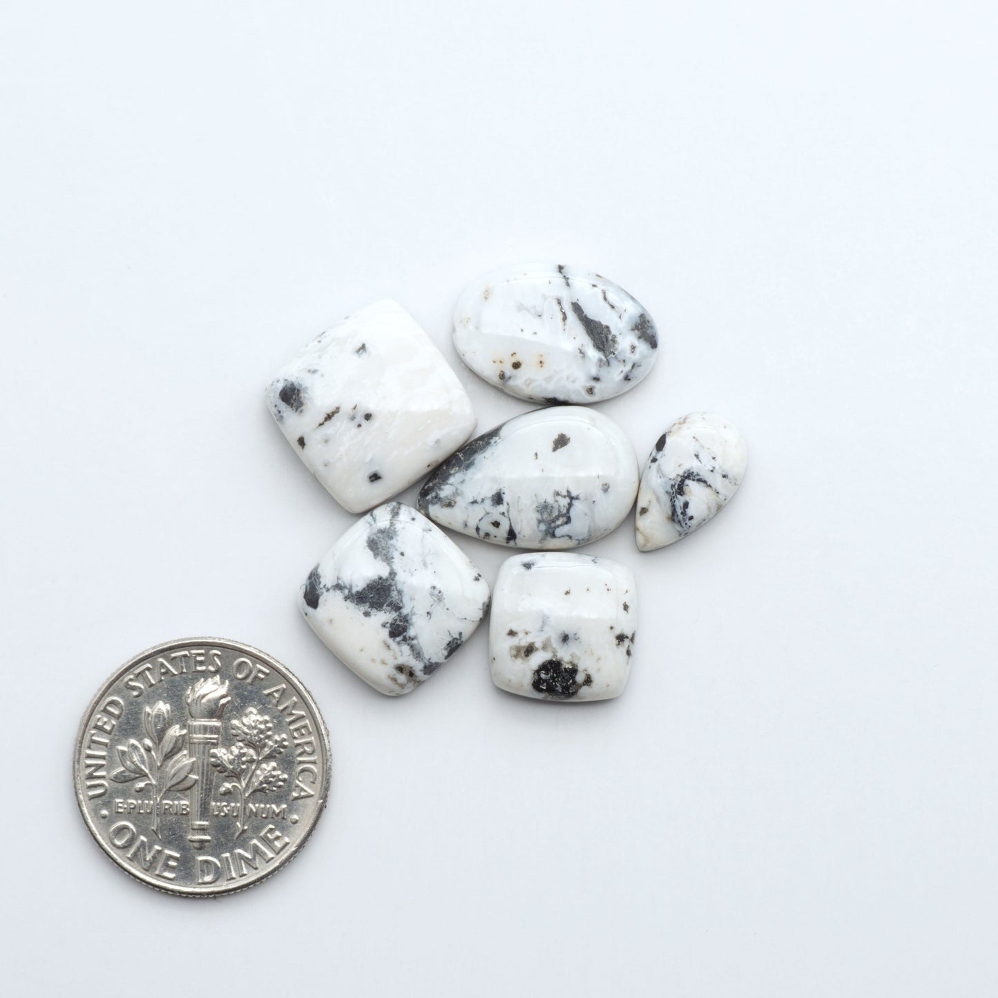 Natural White Buffalo Stone Cabochons are semi-precious gemstones cut into shapes ideal for jewelry-making, making them an excellent choice for artisans.
