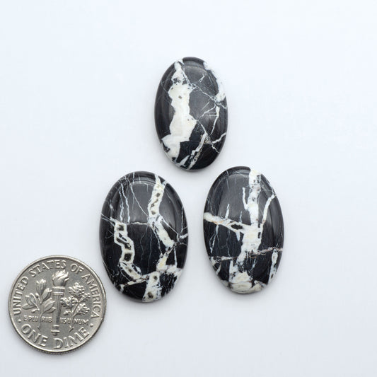 Natural White Buffalo Stone Cabochons are semi-precious gemstones cut into shapes ideal for jewelry-making, making them an excellent choice for artisans.