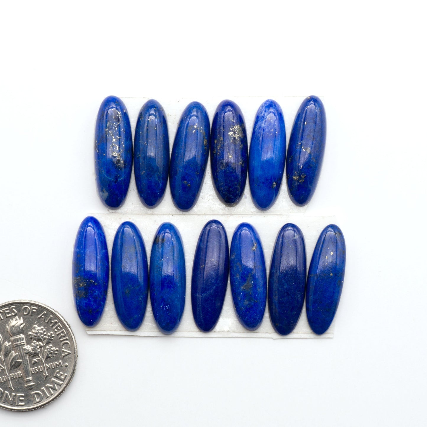 Shop natural Lapis Lazuli cabochons with rich blue tones and golden pyrite, perfect for silversmiths and jewelry makers designing custom pieces.