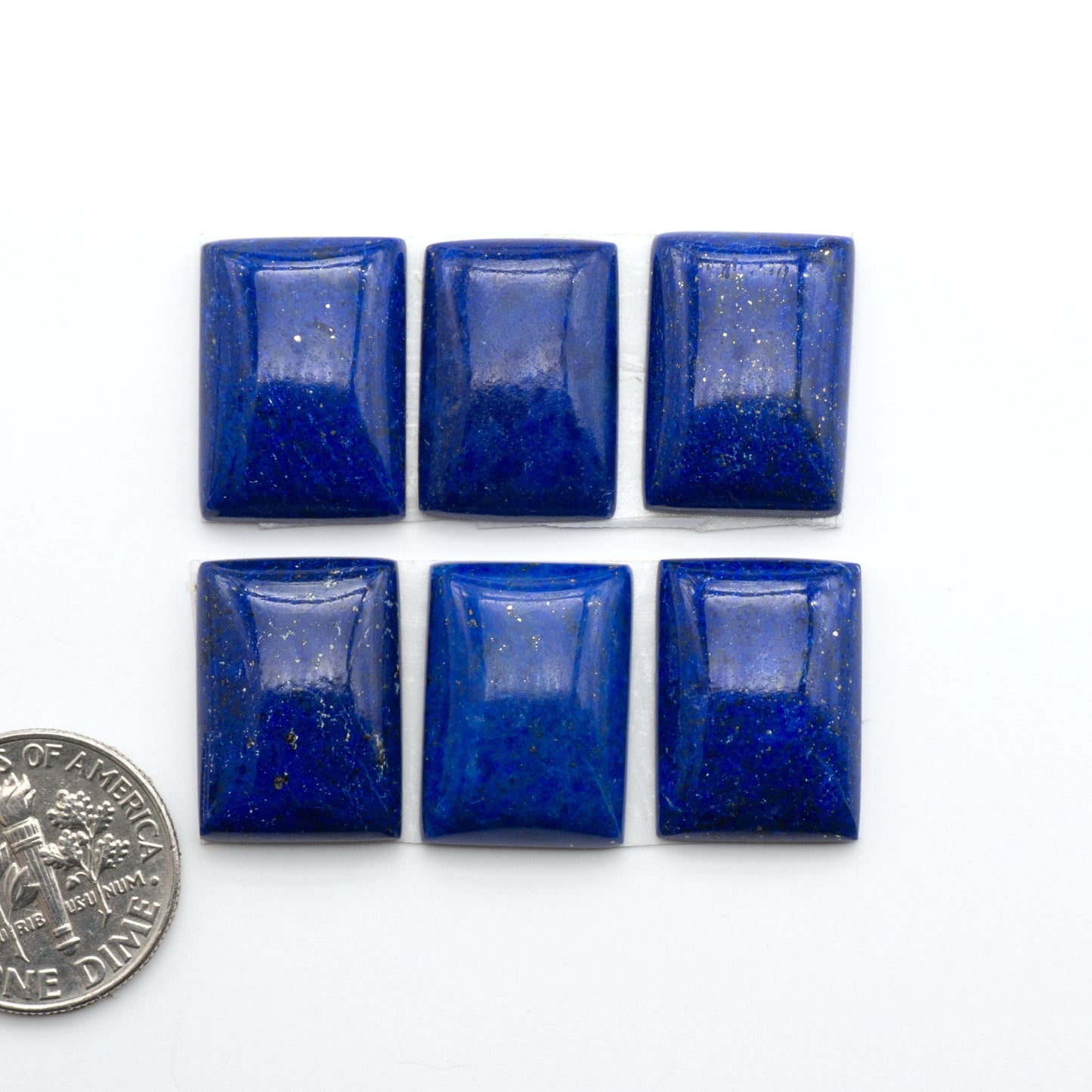 Shop natural Lapis Lazuli cabochons with rich blue tones and golden pyrite, perfect for silversmiths and jewelry makers designing custom pieces.