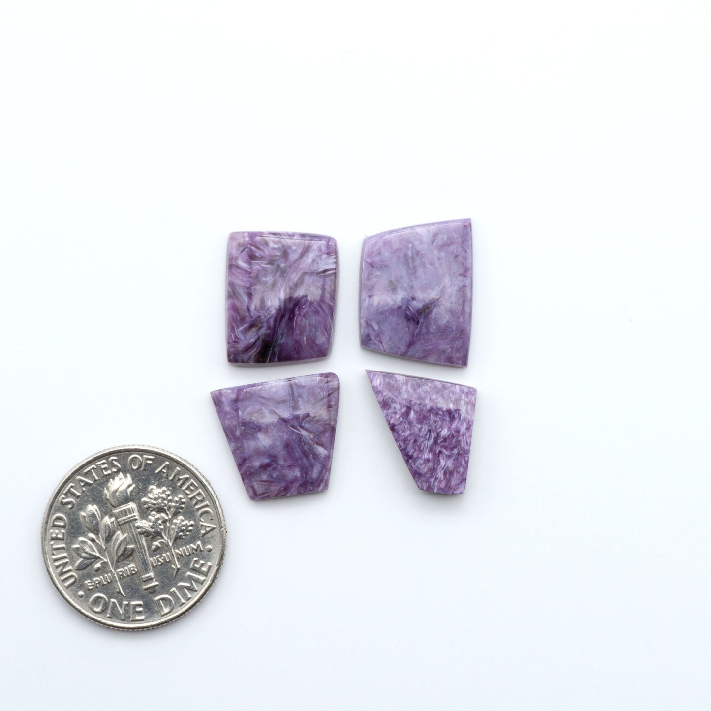 natural Charoite cabochons with vivid violet swirls, perfect for jewelry makers and silversmiths creating rings, pendants, and custom designs.