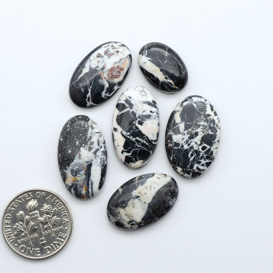 Natural White Buffalo Stone Cabochons are semi-precious gemstones cut into shapes ideal for jewelry-making, making them an excellent choice for artisans.