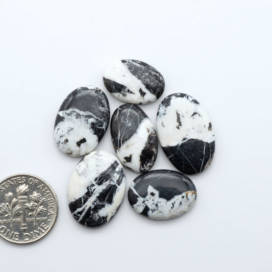 Natural White Buffalo Stone Cabochons are semi-precious gemstones cut into shapes ideal for jewelry-making, making them an excellent choice for artisans.