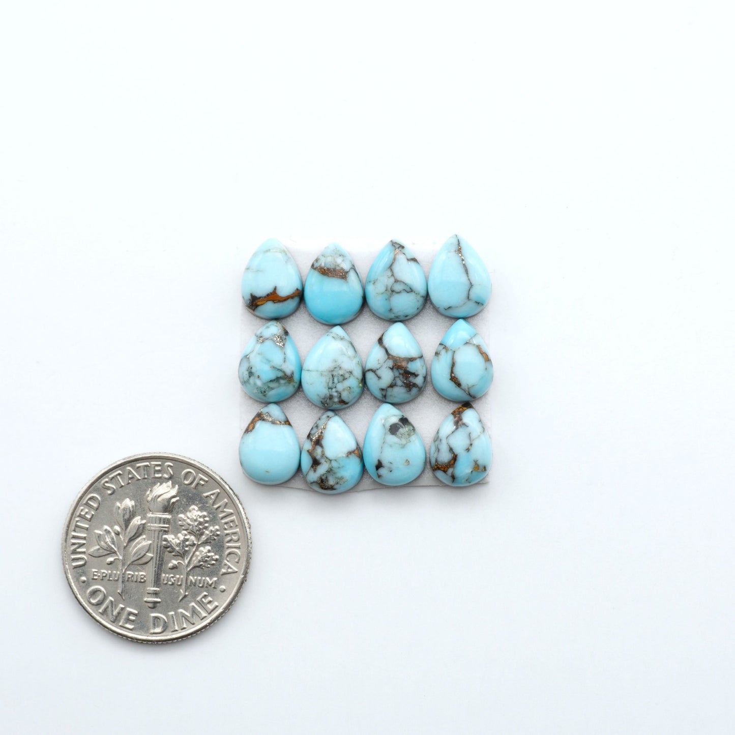 Enhance your jewelry designs with Pressed Turquoise Nugget Cabochons. Crafted from composite materials they add a captivating touch to your creations.