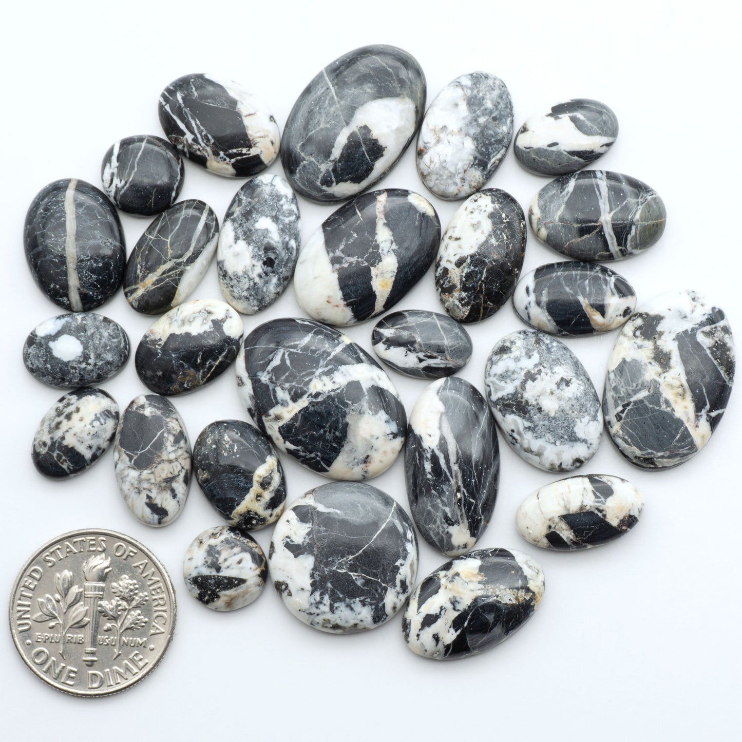 Natural White Buffalo Stone Cabochons are semi-precious gemstones cut into shapes ideal for jewelry-making, making them an excellent choice for artisans.