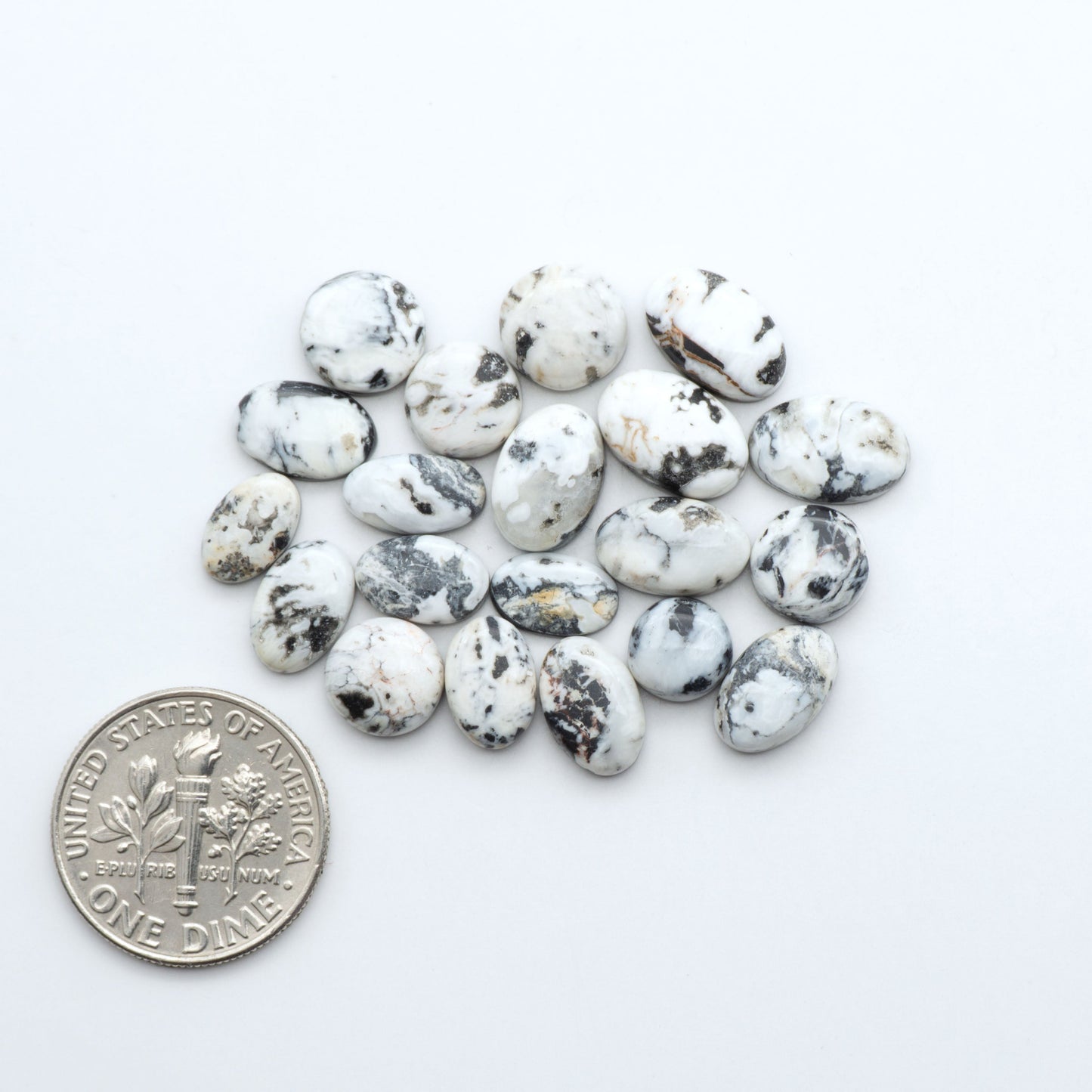 Natural White Buffalo Stone Cabochons are semi-precious gemstones cut into shapes ideal for jewelry-making, making them an excellent choice for artisans.