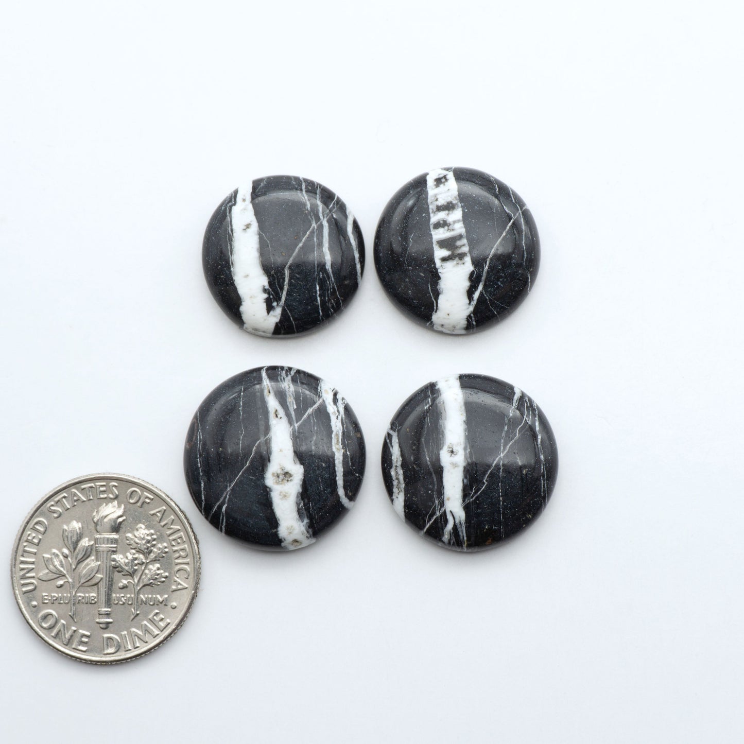 Natural White Buffalo Stone Cabochons are semi-precious gemstones cut into shapes ideal for jewelry-making, making them an excellent choice for artisans.