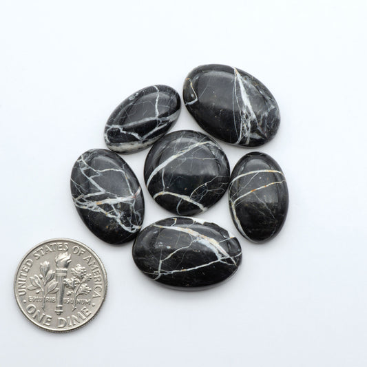 Natural White Buffalo Stone Cabochons are semi-precious gemstones cut into shapes ideal for jewelry-making, making them an excellent choice for artisans.
