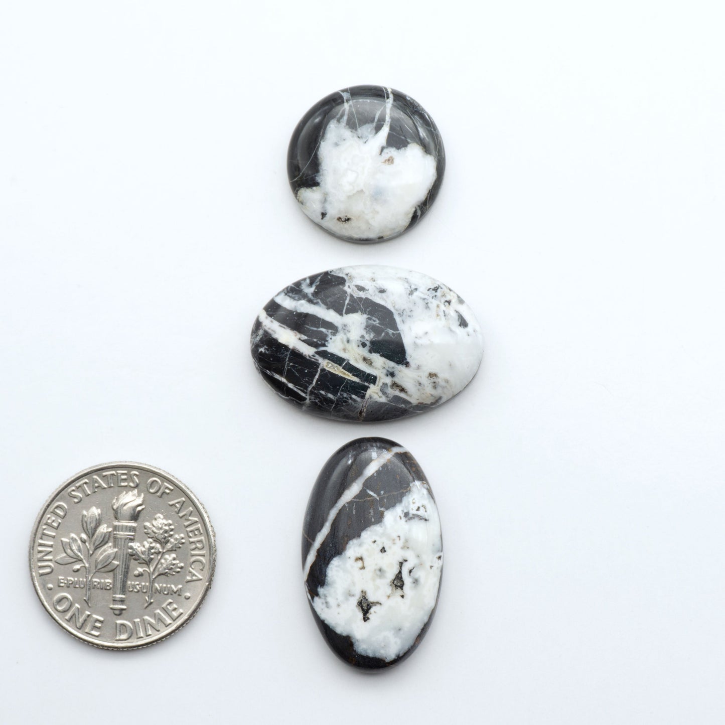 Natural White Buffalo Stone Cabochons are semi-precious gemstones cut into shapes ideal for jewelry-making, making them an excellent choice for artisans.