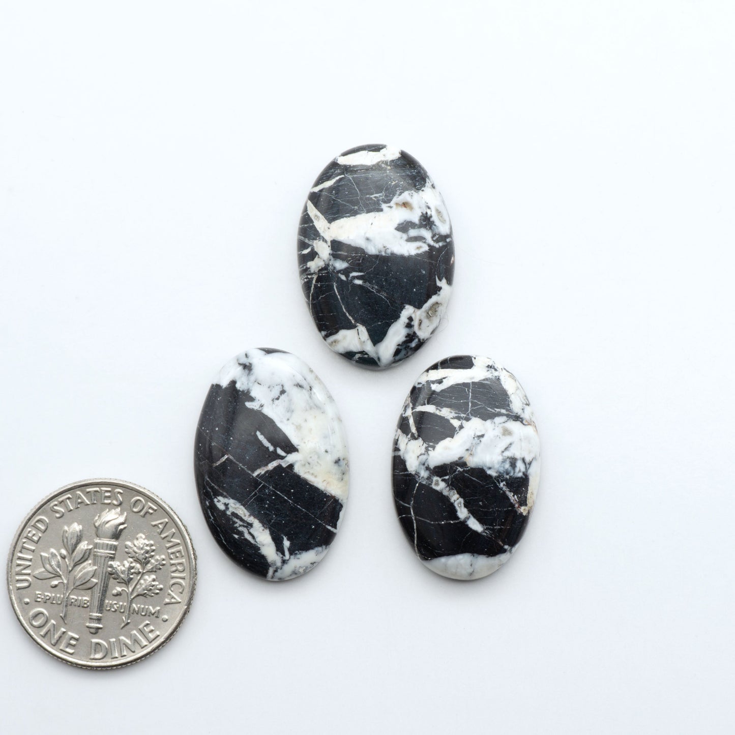 Natural White Buffalo Stone Cabochons are semi-precious gemstones cut into shapes ideal for jewelry-making, making them an excellent choice for artisans.