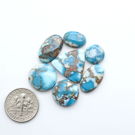 Discover the beauty of Natural Golden Hills Turquoise—prized for its icy blue tones, golden matrix, and exceptional quality. Ideal for artisan jewelry designs.