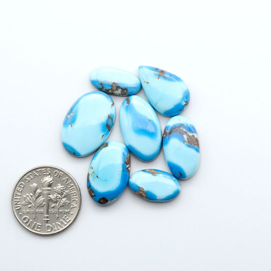 Discover the beauty of Natural Golden Hills Turquoise—prized for its icy blue tones, golden matrix, and exceptional quality. Ideal for artisan jewelry designs.