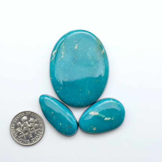 Royston Turquoise cabochons are famous for their distinctive matrix and unique green and blue hues, making them a favored option among jewelry designers.
