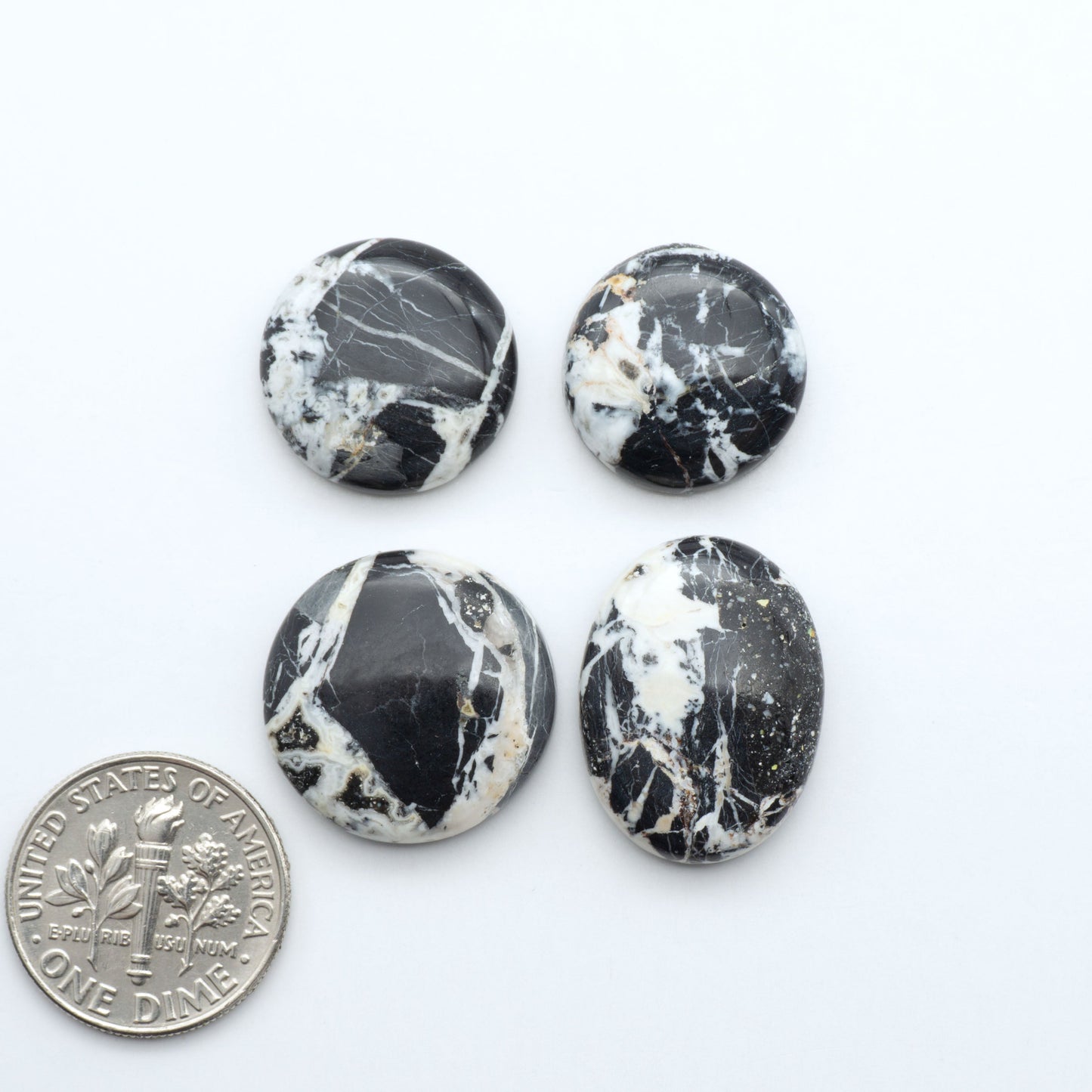 Natural White Buffalo Stone Cabochons are semi-precious gemstones cut into shapes ideal for jewelry-making, making them an excellent choice for artisans.
