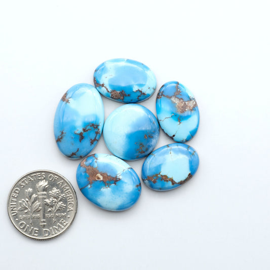 Discover the beauty of Natural Golden Hills Turquoise—prized for its icy blue tones, golden matrix, and exceptional quality. Ideal for artisan jewelry designs.