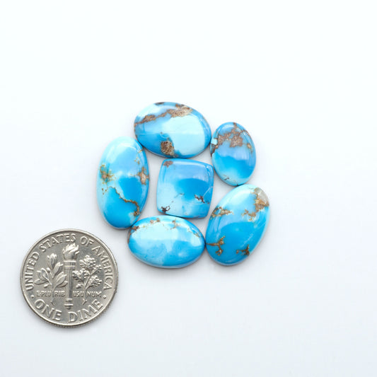 Discover the beauty of Natural Golden Hills Turquoise—prized for its icy blue tones, golden matrix, and exceptional quality. Ideal for artisan jewelry designs.