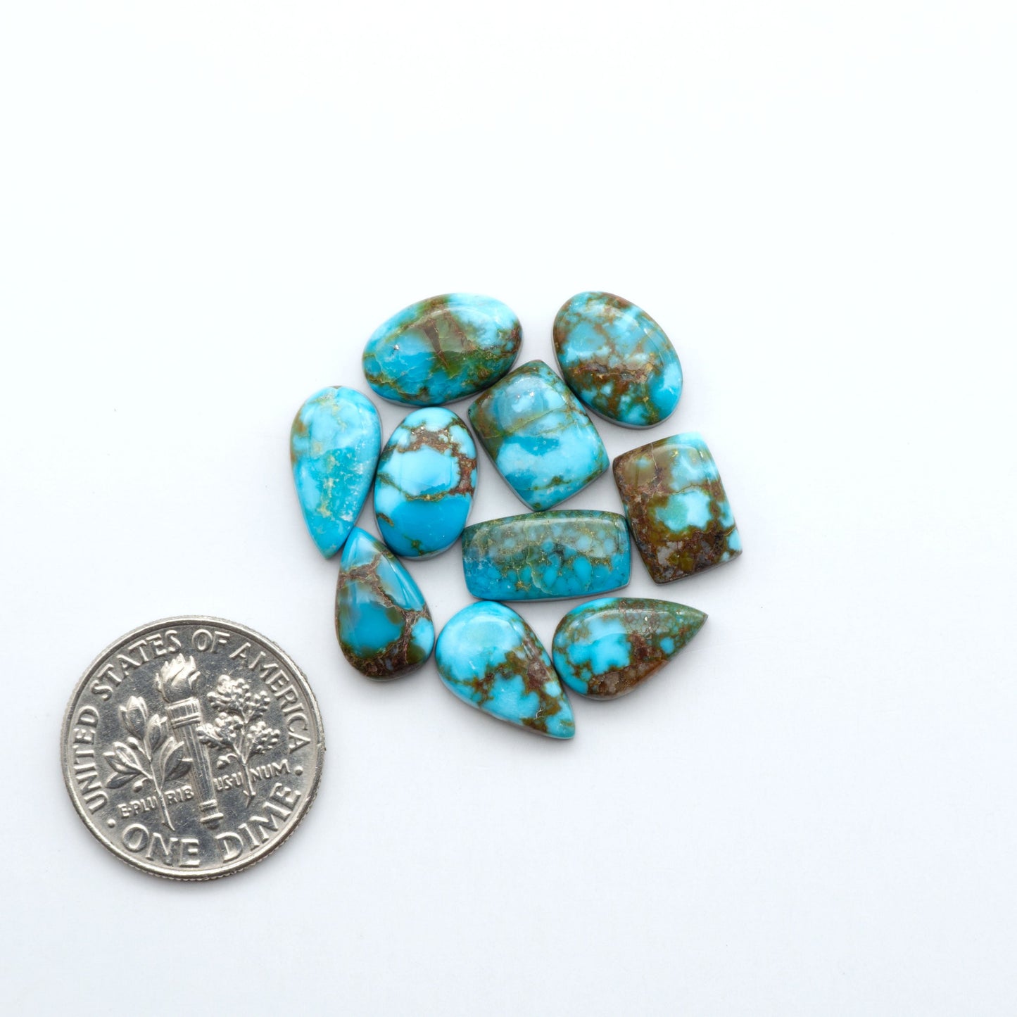 Kingman Turquoise Cabochons are a staple in the jewelry industry, known for their stunning blue-green color. Perfect for necklaces, earrings, and more!