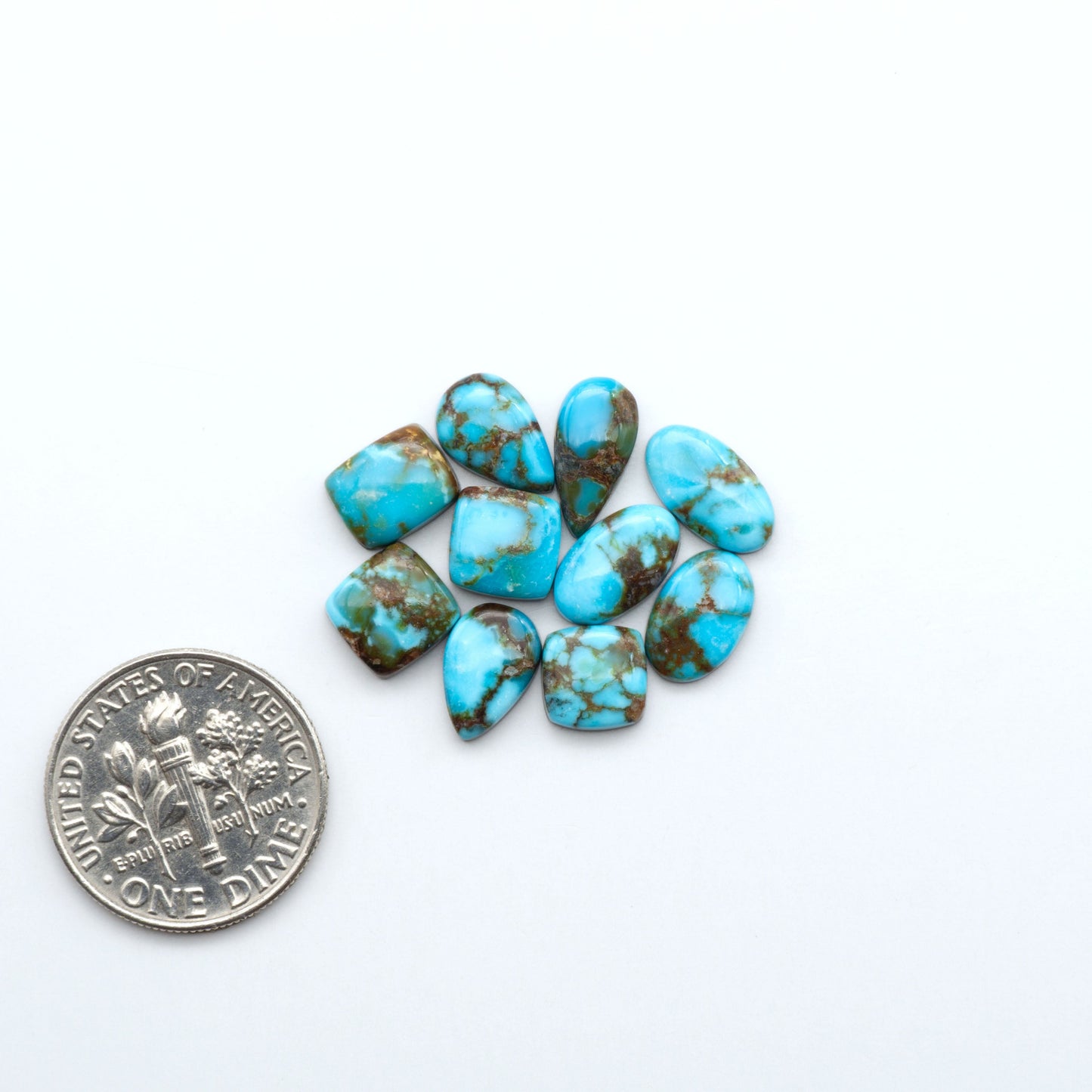 Kingman Turquoise Cabochons are a staple in the jewelry industry, known for their stunning blue-green color. Perfect for necklaces, earrings, and more!
