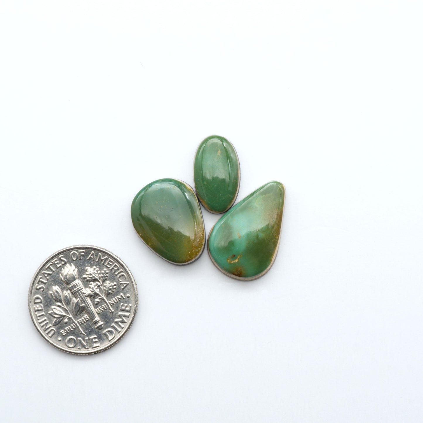 Hand-cut Natural Cerrillos Turquoise cabochons with rare blue-green hues and historic New Mexico origins—perfect for artisan jewelry.