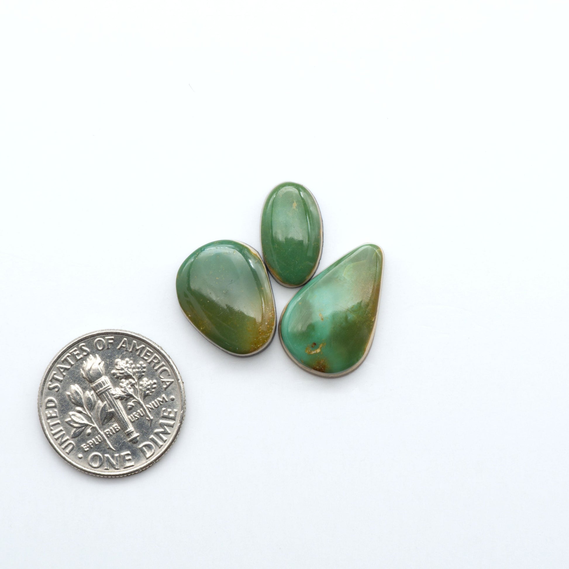 Hand-cut Natural Cerrillos Turquoise cabochons with rare blue-green hues and historic New Mexico origins—perfect for artisan jewelry.