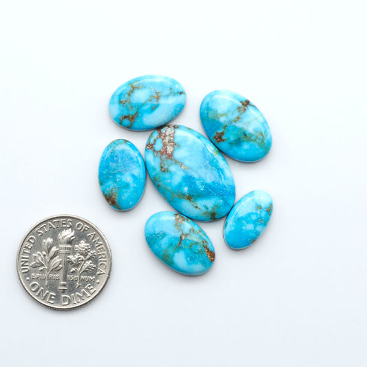 Kingman Turquoise Cabochons are a staple in the jewelry industry, known for their stunning blue-green color. Perfect for necklaces, earrings, and more!