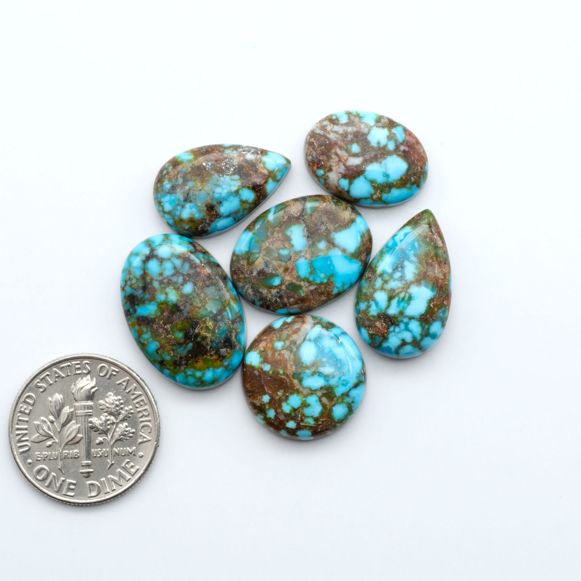 Kingman Turquoise Cabochons are a staple in the jewelry industry, known for their stunning blue-green color. Perfect for necklaces, earrings, and more!